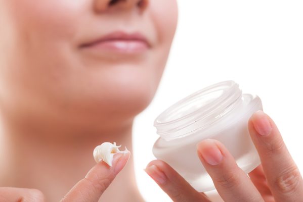 cosmetic skin care windsor - girl applying moisturizing cream