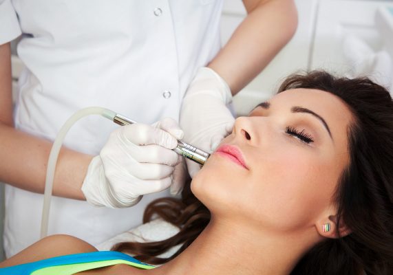skin clinic birmingham - Woman getting laser face treatment